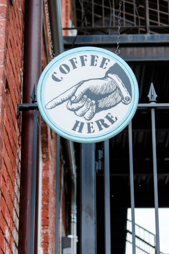 Coffee Here sign at Ironclad Coffee Café